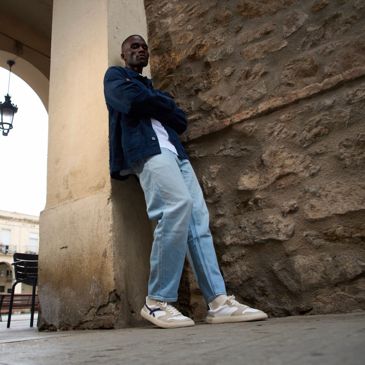 Boy wearing blue and white barefoot sneakers