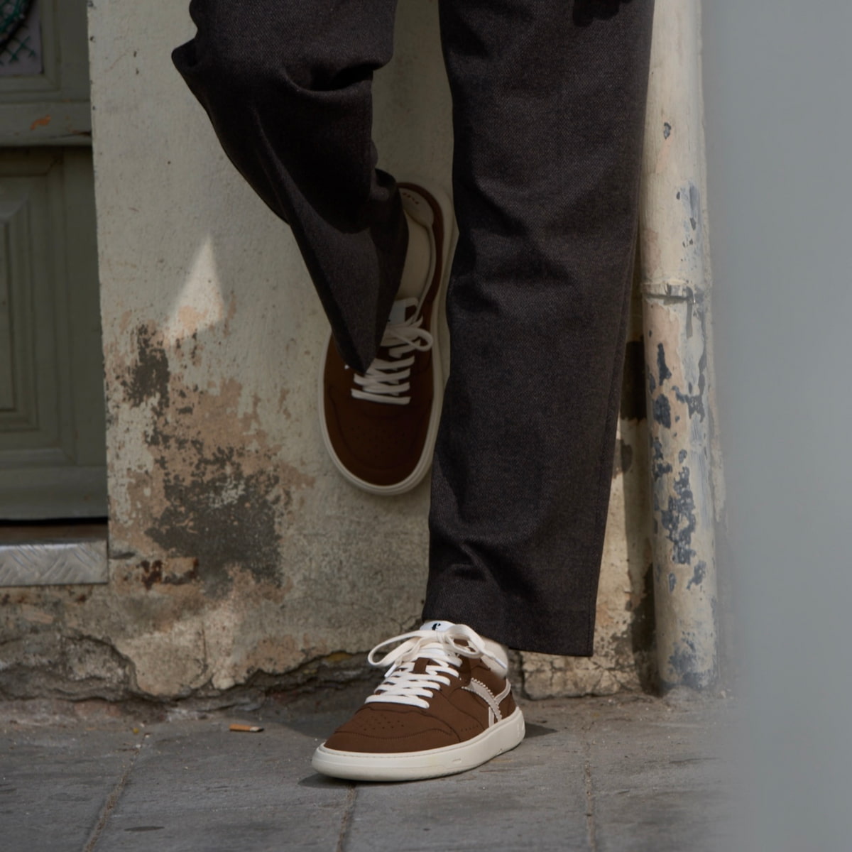 person wearing brown barefoot sneakers 