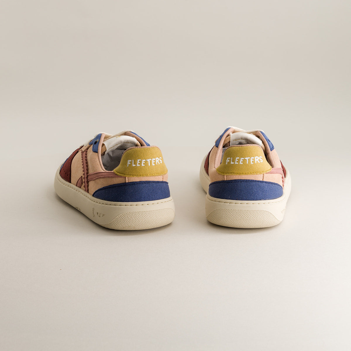 Pair of colorful sneakers with 'Fleeters' branding on a light background