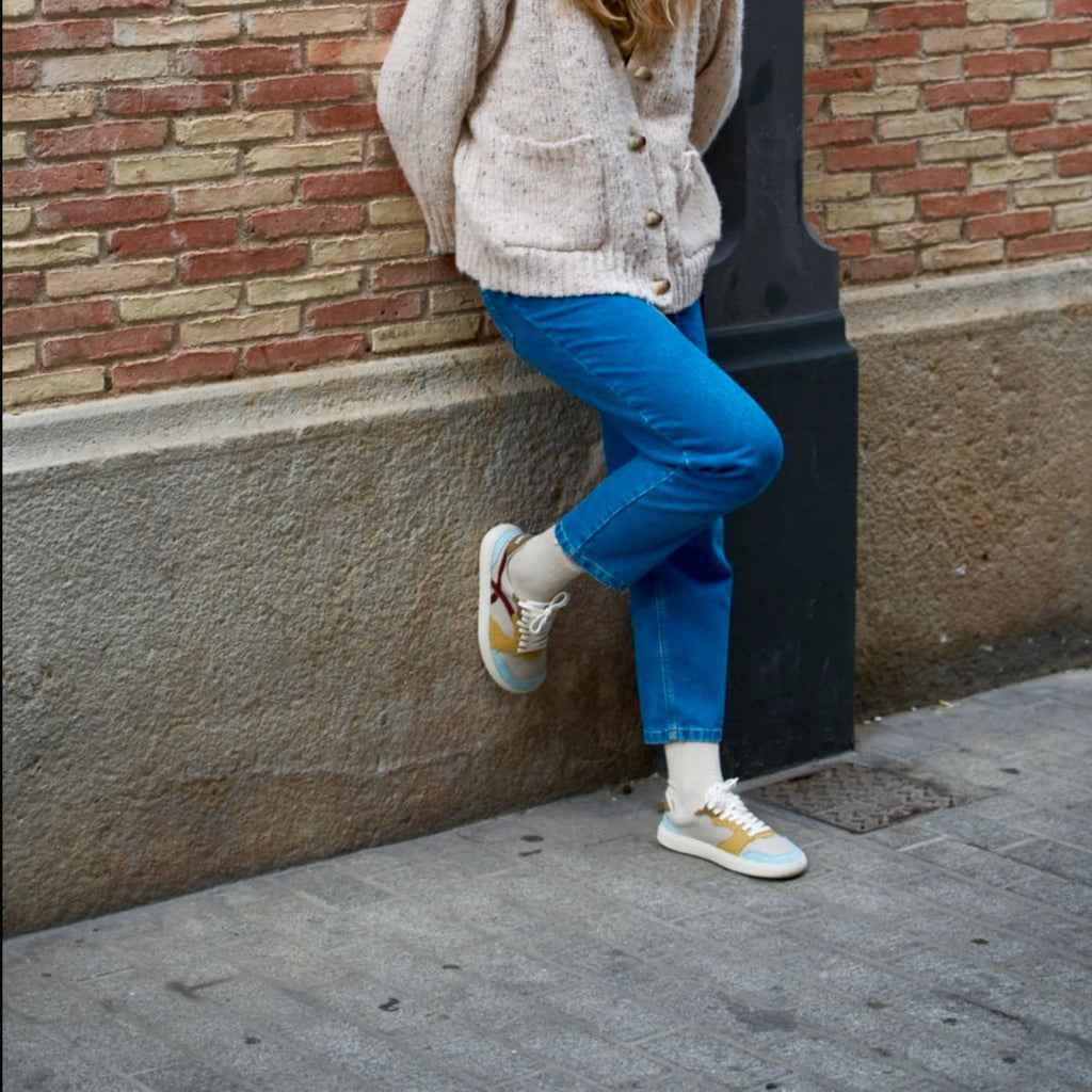 girl wearing multicolored barefoot sneakers