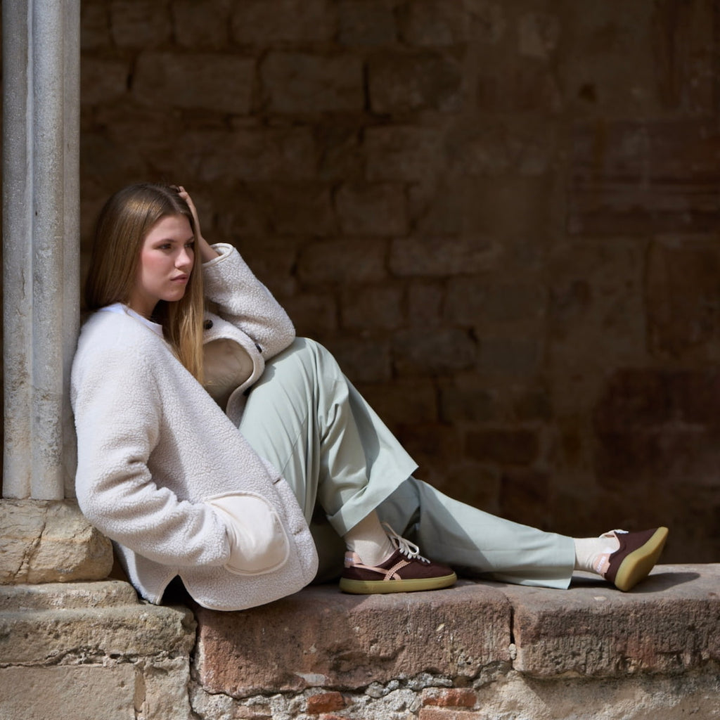 Girl wearing brown and pink barefoot sneakers 