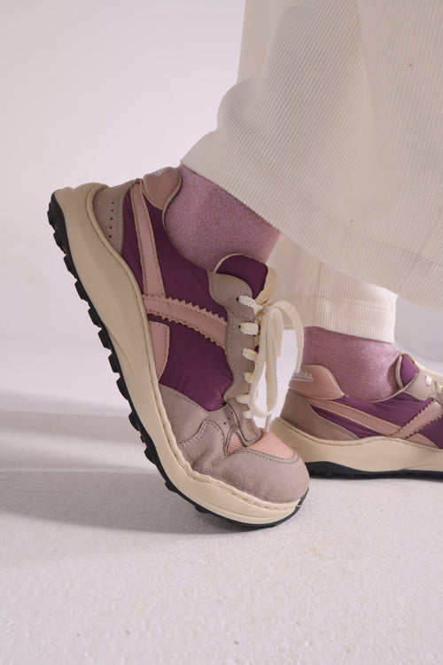 A woman wearing retro run barefoot sneakers
