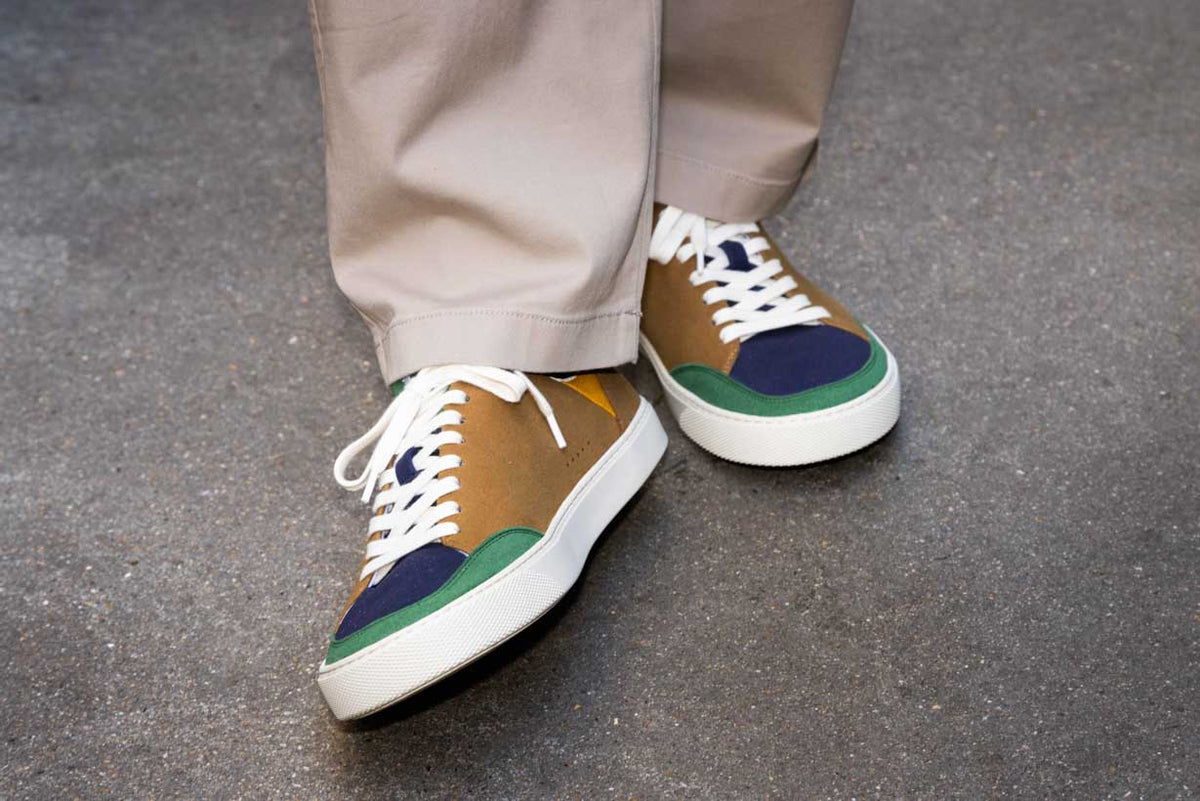 Multicolor barefoot sneakers, on a concrete background